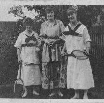 Three women with tennis rackets at Thompson Lane, Southampton court