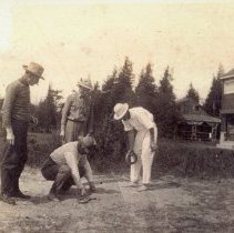 Playing quoits at Halliday Cottage