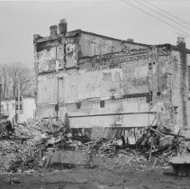 K-71-01-31 - South wall of Chesley Enterprise after fire & demolition, 1971