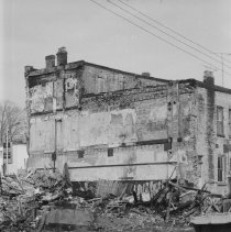 K-71-01-32 - South wall of Chesley Enterprise after fire & demolition, 1971