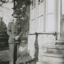 Page 05b - Telford Biehn standing by house