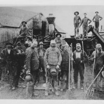 Group of men with agricultural machinery