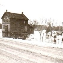 Clark home, Pinkerton, surrounded by flood