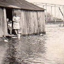 Clark house in a flood with Annabelle Clark and children