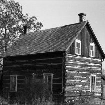 K-61-01-20 Log house on highway just west of Berford Lake, Spring 1961