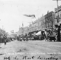 K-59-13-03 160th Bruce Battalion marching through Main St., Chesley, Ont.,