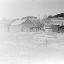 K-67-38-35 Log cabin with lean-tos and out building