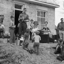K-68-09-01 Cliff Gilbert auctioning off Collie pups at Purple Valley.