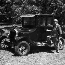 K-74-14-27 Alden Rourke with his 1921 Ford Coupe in Arran Township