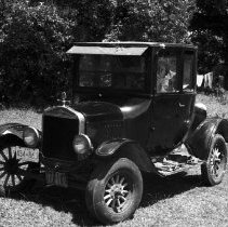 K-74-14-28 Alden Rourke with his 1921 Ford Coupe in Arran Township