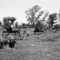 K-74-14-29 Buggy and other equipment/machinery in a farm yard, July 1974