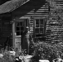 K-74-14-34 Alden Rourke at back of door of house, Arran Township. 1974