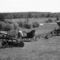 K-74-14-36 Farm equipment laid out in a farm yard, Arran Township, 1974