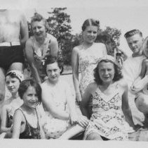 A2008.035.015a - 8 Unidentified Adults And 1 Child Dressed In Bathing Suits