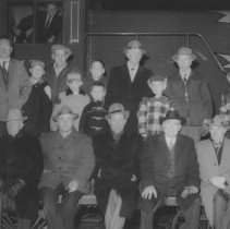 Men and boys beside train