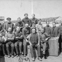 Group of men on Tobermory dock, front