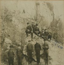 Photograph of group of men and a young boy