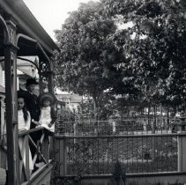 Three children on a porch in the Kincardine area.
