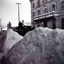 Two large piles of snow in the central business district of Kincardine.