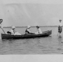 People and a canoe and a dog