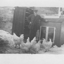 A man with 7 chickens