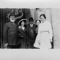 Men and women in front of a building