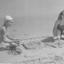 Girls playing in sand