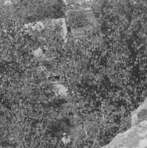Man standing at bottom of escarpment