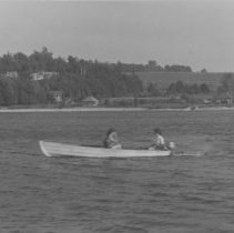 Two women motorboating