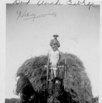 Uncle George McKay and Dorothy haying