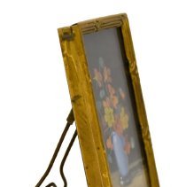 Untitled [Orange, yellow and maroon flower bouquet in light blue vase]