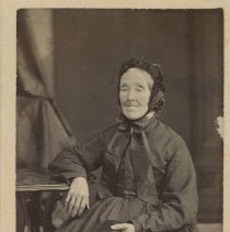 Woman in a dark full length dress - Front