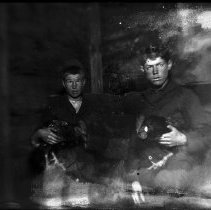 Two boys with chickens