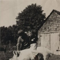 Glen Johnston riding a pig