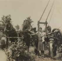 Dalton, Ella, Eddy, and Ken Wright with drilling equipment