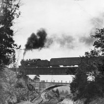 Unidentified train crossing bridge.