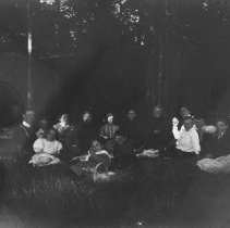 K-81-13-15 Unidentified group of people having a picnic in the woods.