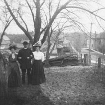 K-81-13-02 Portrait of a man and two ladies in fine clothing.