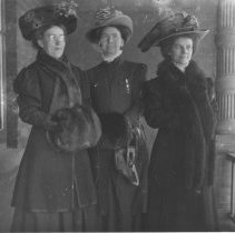 K-81-13-22 Three women in hats and fur accessories.