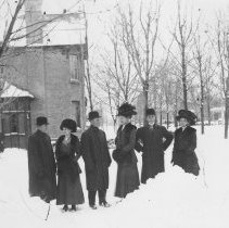 K-81-13-28 Three couples posing outside during the winter. House behind.