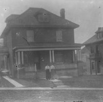 K-81-13-03 Two ladies in front of a house.