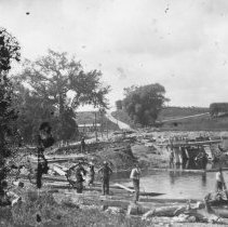 K-81-13-30 Several men on river with logs and driftwood.