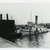 Tugboat "Percival" working with dredger