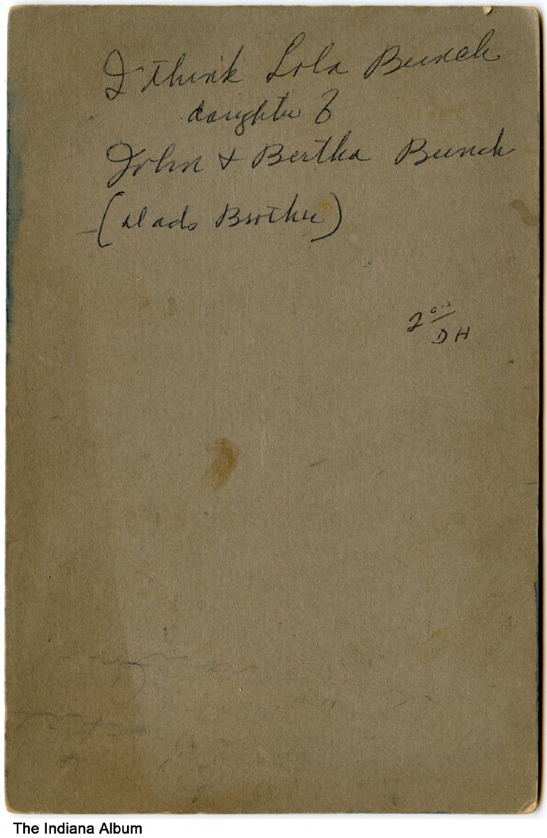 Girl holding dolls, Sullivan, Indiana, circa 1900 Handwritten on the