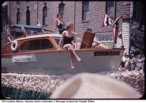 Bathing beauties on Aqua Queen float in Warsaw Centennial Parade, Warsaw, Indiana, July 5, 1954