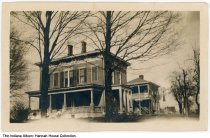 Woman sitting on the front steps of Hannah House, Indianapolis, Indiana, ci