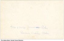 Marion and Romena Elder next to the porch of Hannah House, Indianapolis, In