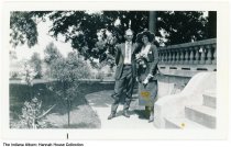 Marion and Romena Elder next to the porch of Hannah House, Indianapolis, In
