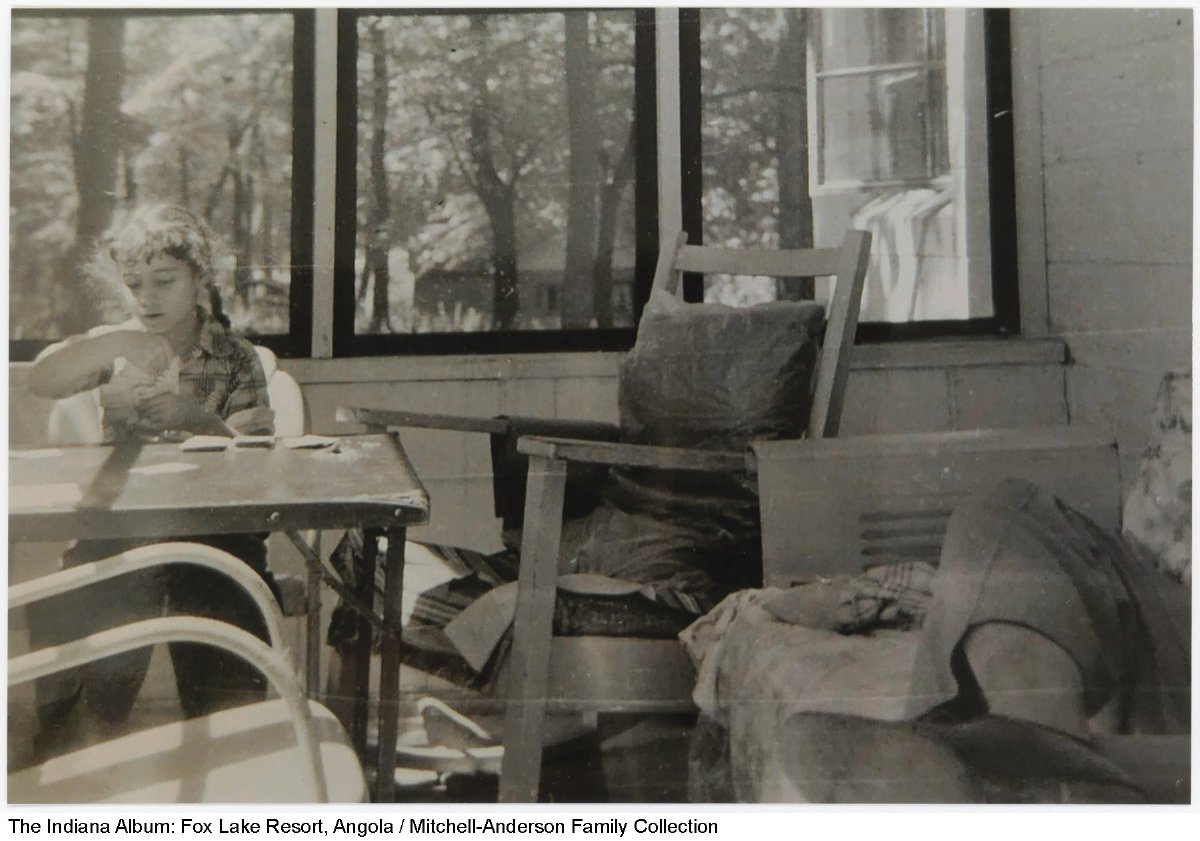 Girl playing cards in porch at Fox Lake, Angola, Indiana, circa 1954