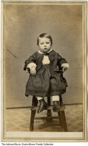 Unidentified child in high chair, Richmond, Indiana, 1865
